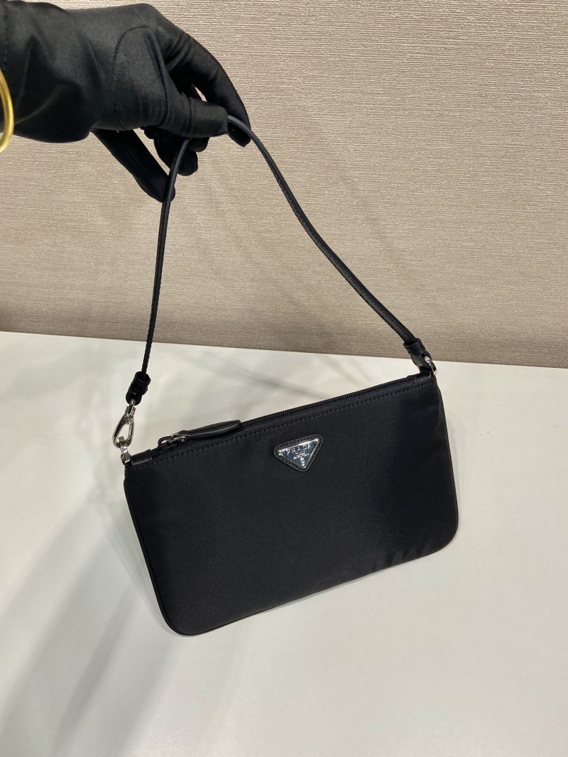 Pra*a clutch bags